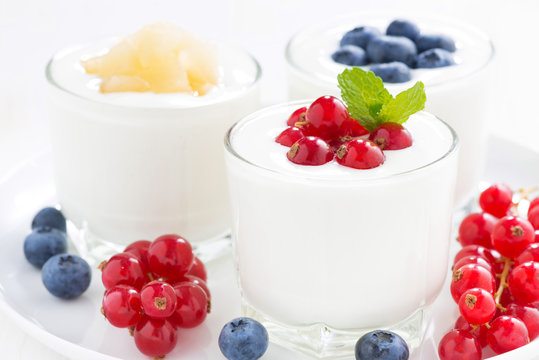 dietary product - assortment yogurt with fresh berries, close-up