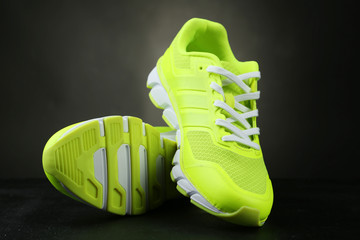 Pair of sport shoes on black background
