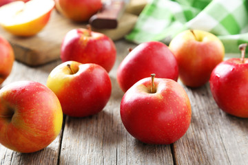Red apples on grey wooden background