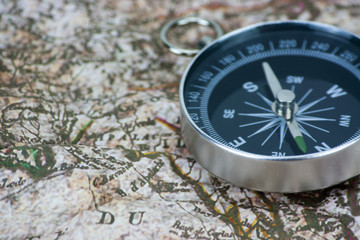 Fototapeta na wymiar Finding Your Direction - Compass and Map