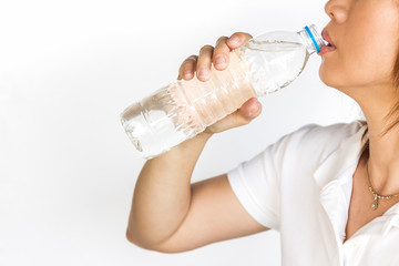 Young woman with bottle of mineral water.