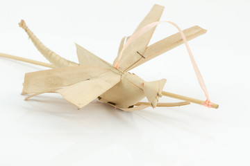 origami dragonfly from coconut leaf isolated.