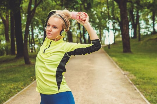 Woman doing stretching exercise before running