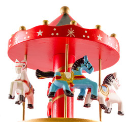Colored carousel toy with horses, close up, isolated