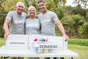 Happy family volunteer smiling at camera 