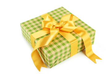Gift box with golden bow isolated on white