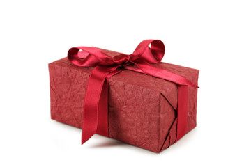 Gift box with burgundy bow isolated on white