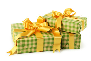 Gift box with golden bow isolated on white