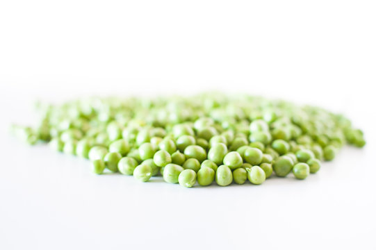 Heap of fresh peas isolated on white