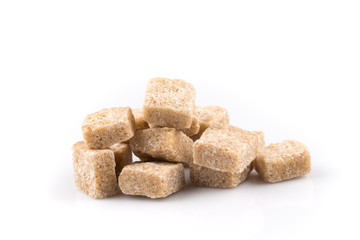 Heap brown sugar cubes isolated