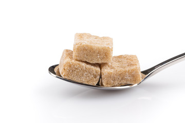 Cubes of sugar on a spoon