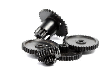Plastic gears of different sizes on a white background