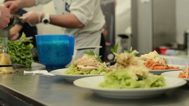 waiter carries meals to customers