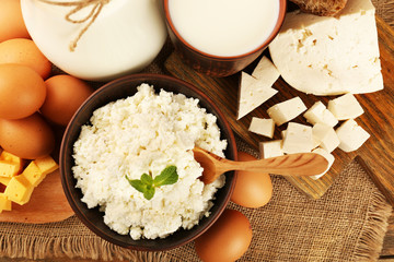 Tasty dairy products on sackcloth background