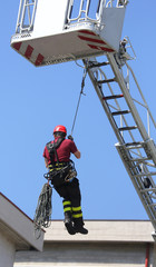 Fototapeta premium firefighter hung the rope climbing