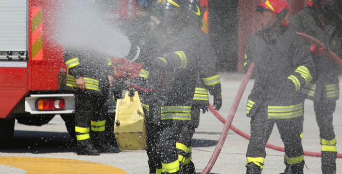 firefighters with the fire extinguisher during a practice sessio