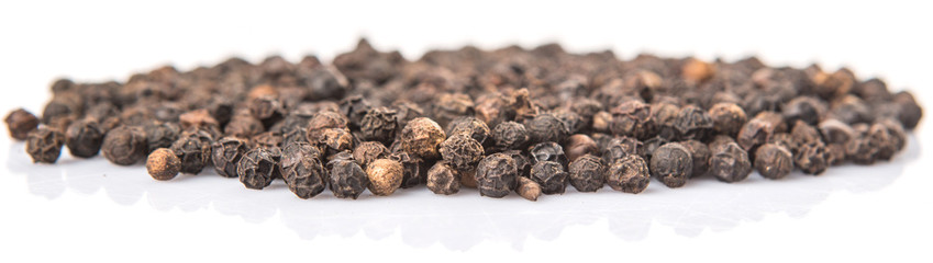 Black pepper over white background