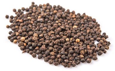 Black pepper over white background