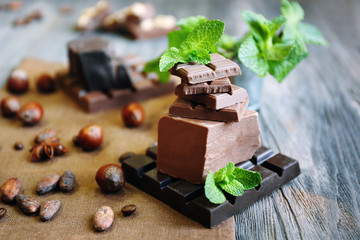 Set of spicy chocolate on wooden table, closeup