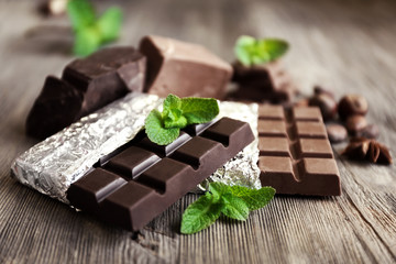 Set of spicy chocolate on wooden table, closeup