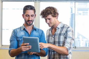Fototapeta premium Business team looking at tablet