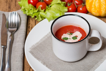 fresh tomato soup in a white bowl