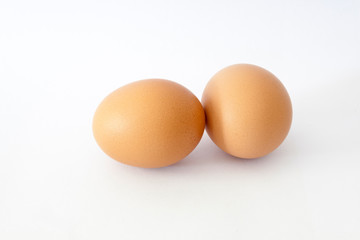 brown chicken egg isolated on white.
