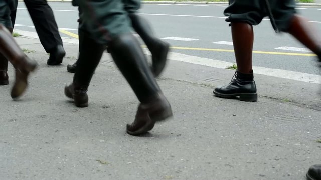 commemorate the victims of World War II at the cemetery - the official march of soldiers and other people - closeup legs