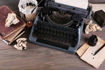 Retro typewriter on wooden table, top view
