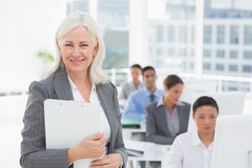 Smiling businesswoman looking at camera 