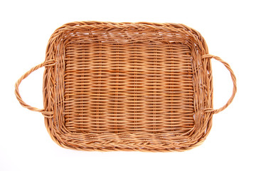 Brown wicker basket isolated on white background, top view