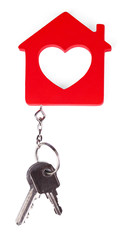 Toy house with key isolated on white