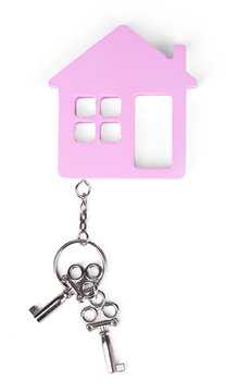 Toy house with key isolated on white