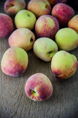 group of fresh peaches on wood background