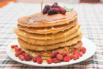 Delicious pancakes with fresh mulberry and honey