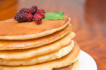 Delicious pancakes with fresh mulberry and honey