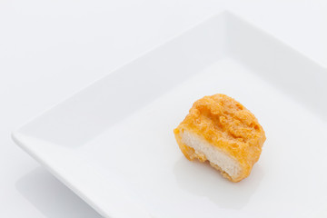 Fried chicken nuggets on white dish