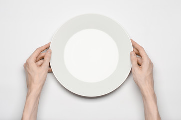 the human hand show gesture on an empty white plate in studio