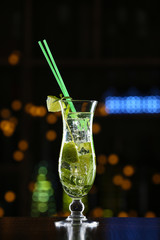 Glass of cocktails on bar background