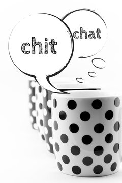 Coffee mugs with speech bubbles Chit chat isolated on white 