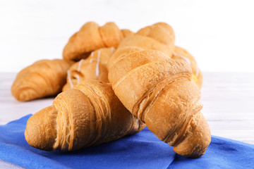 Delicious croissants on table close-up