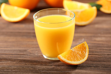 Naklejka na ściany i meble Orange juice on table close-up