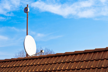 satellite dish on the red roof