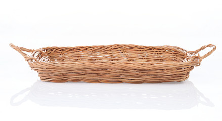 Fototapeta premium Brown wicker basket on white background, side view
