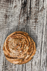 Puff Paste Sesame Roll On Old Cracked Wood Background.