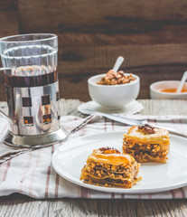 pieces of baklava with honey and nuts, rustic,  Turkish dessert
