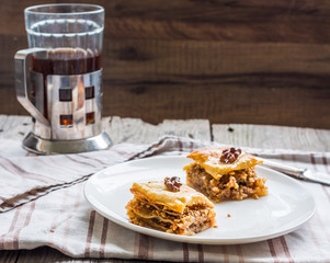 pieces of baklava with honey and nuts, rustic,  Turkish dessert