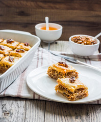 pieces of baklava with honey and nuts, rustic,  Turkish dessert