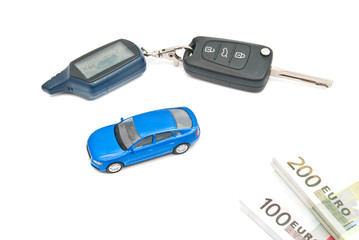 blue car, keys and notes on white