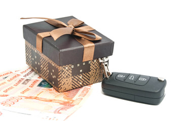 brown gift box, keys and money